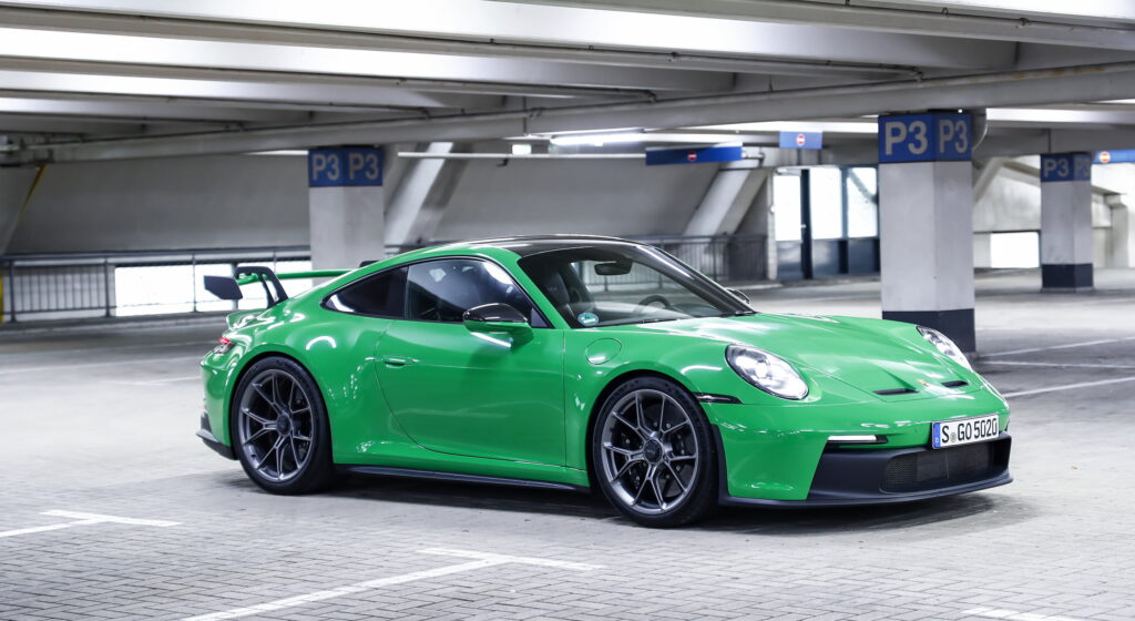 Green Porsche in parking